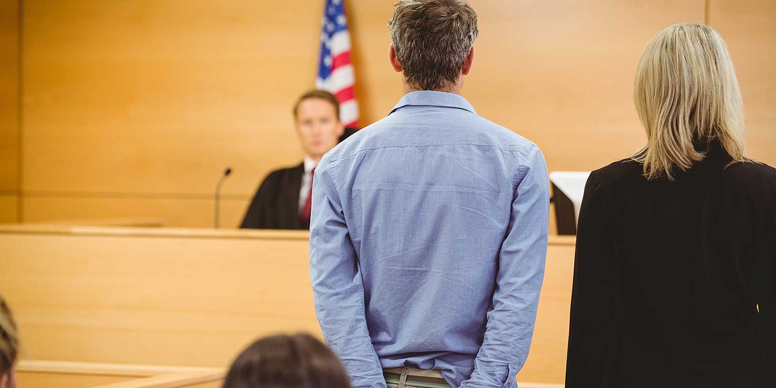 Handcuffed individual representing a first DUI arrest in Colorado Springs.