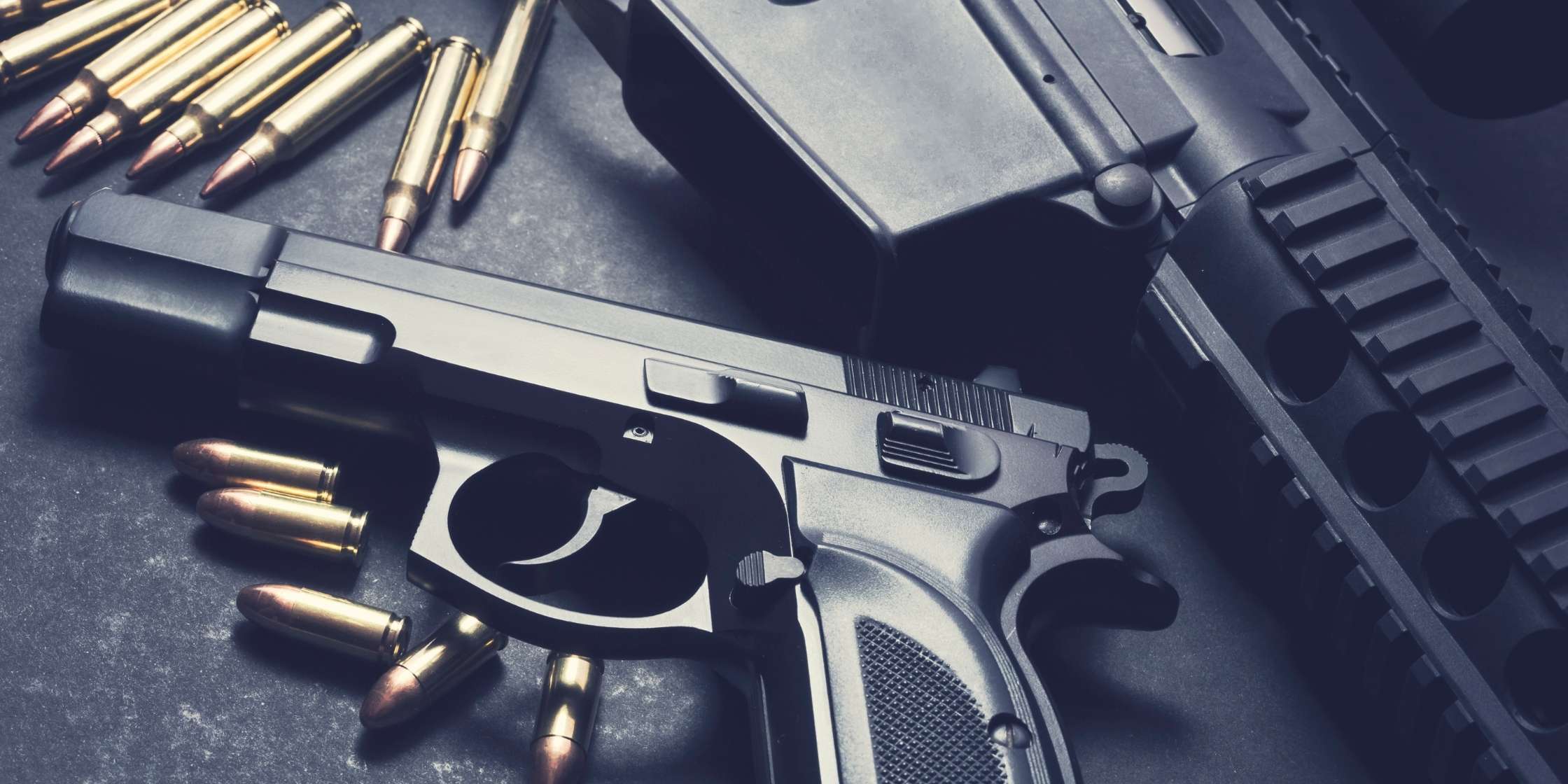 Legal Defense for Weapons Charges in Colorado, handgun and ammunition on table for weapons charge defense in Colorado