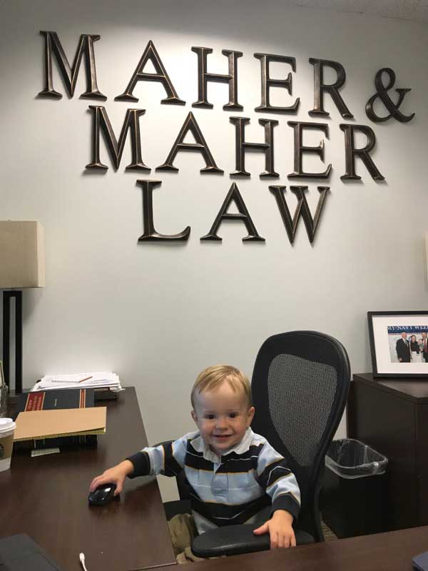 Photo of Maher & Maher's small office and a simple sign on day one. Photo of Maher & Maher's small office and a simple sign on day one.